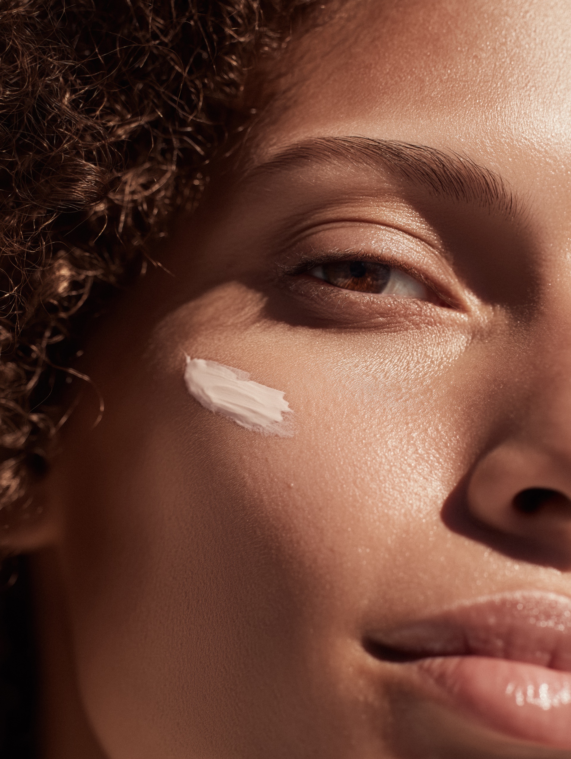 Close-up of a face with skincare cream