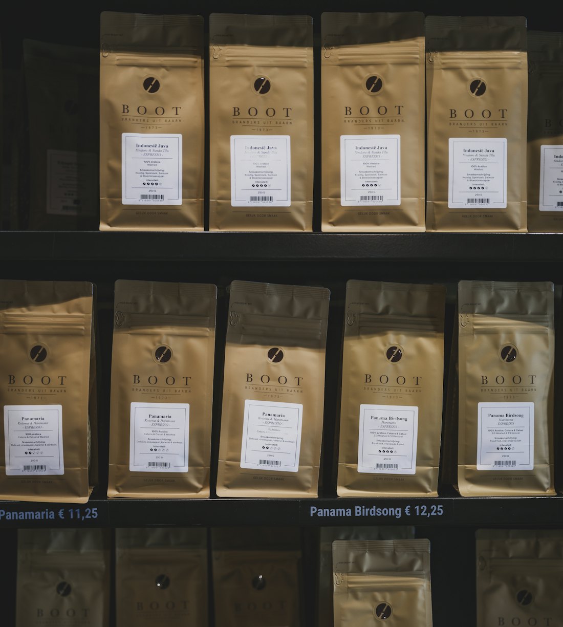 Shelves of retail coffee bags in a café