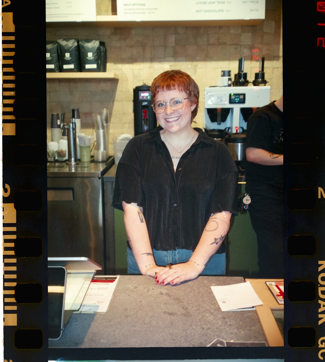 A barista at the counter taking an order