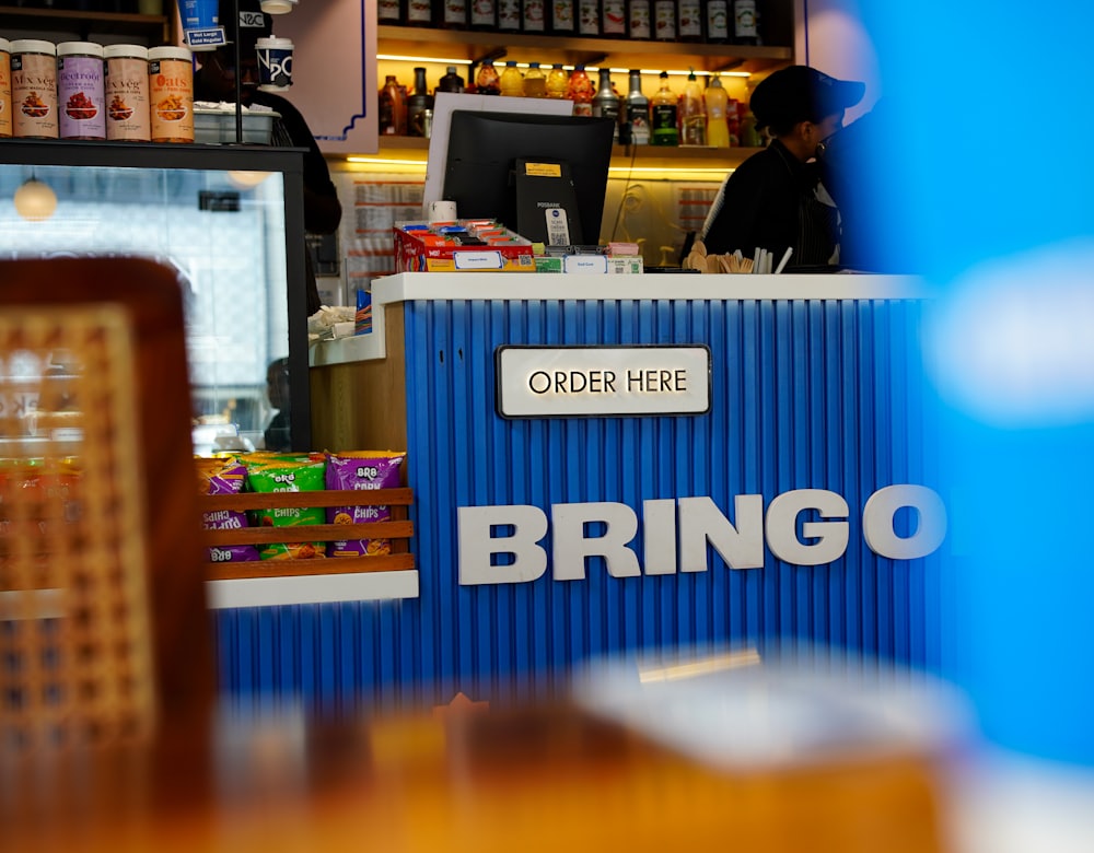 Customers ordering at a café counter